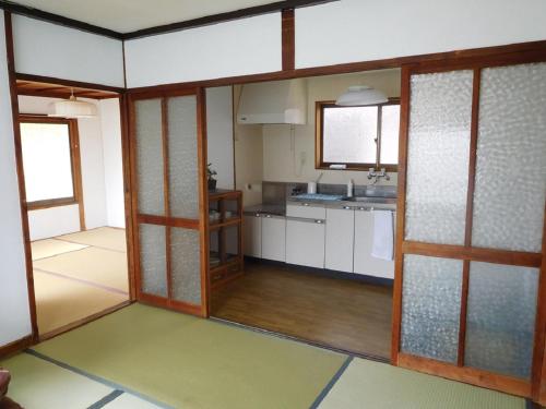 Kuchyň nebo kuchyňský kout v ubytování ゲストハウス尾道ポポー Guesthouse Onomichi Pawpaw