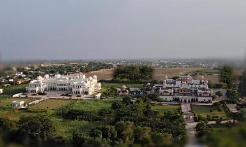 an aerial view of a large white mansion at Laxmi Vilas Palace in Bharatpur