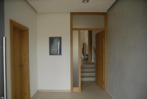 a hallway with two doors and stairs in a house at LICHTECK - Helle Ferien in Breitenberg