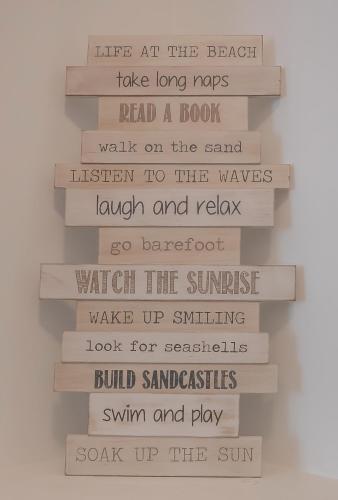 a stack of books with the words in different fonts at Sanctuary Lake Apartments in Gold Coast