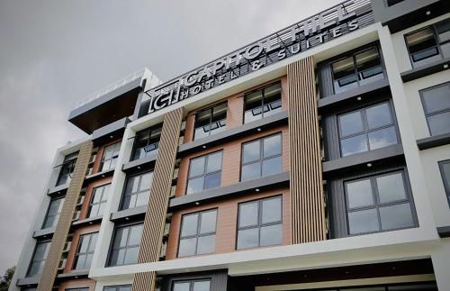 a building with a sign on the top of it at Capitol Hill Hotel and Suites in Angeles