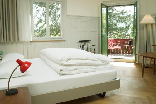 
Ein Bett oder Betten in einem Zimmer der Unterkunft Militärkantine St. Gallen
