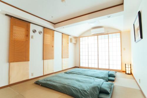 Krevet ili kreveti u jedinici u objektu まるまる貸切,羽田空港から一番近いyu`s house