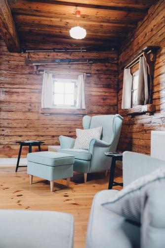 a living room with two chairs and a couch at Ferienhaus am Keltenkogel in Großklein