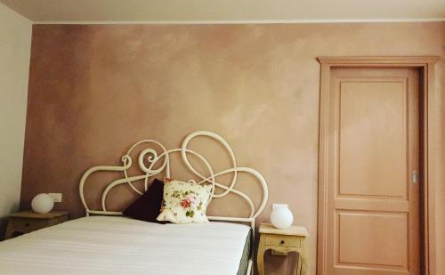 a bedroom with a bed with a white bedspread at 1848 Chef's Rooms in Gorizia