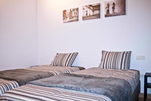 Posteľ alebo postele v izbe v ubytovaní Urban Manesa city center apartment with private patio
