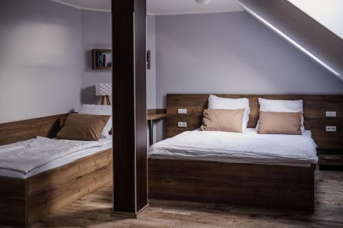 Postel nebo postele na pokoji v ubytování Penzion Prestige Tennis Park