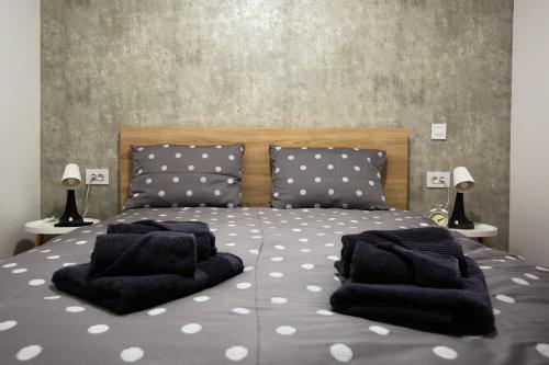 Кровать или кровати в номере Gloria Rooms
