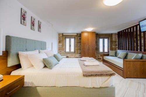 A bed or beds in a room at Agarathos Deluxe Homes - Kaliviani -On the road to Balos