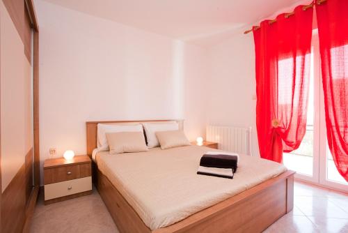 Posteľ alebo postele v izbe v ubytovaní Apartments Melita