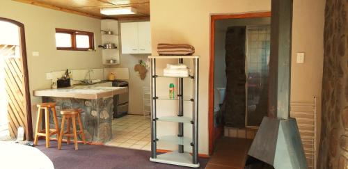 a kitchen with a sink and a refrigerator in it at Masalimo Cottage in Rhodes