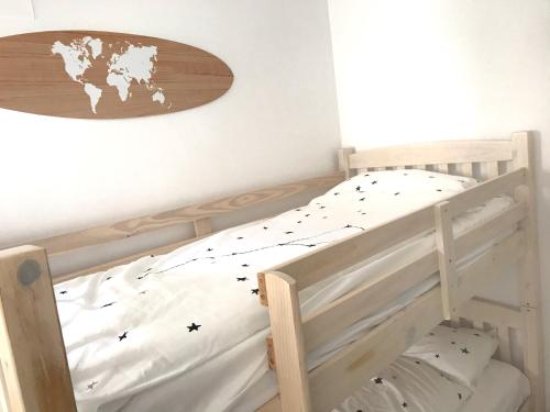 a bedroom with a bunk bed with a surfboard on the wall at Cabanyal Beach House in Valencia