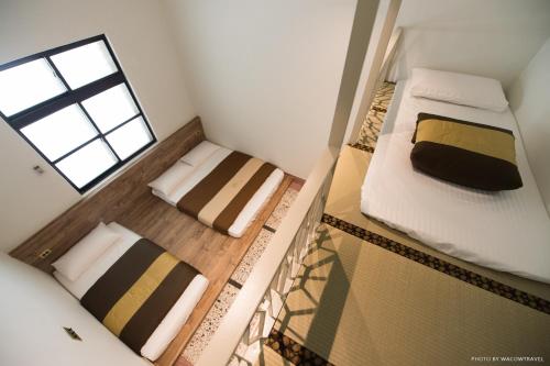 Cama o camas de una habitación en 極の宿 eXtreme