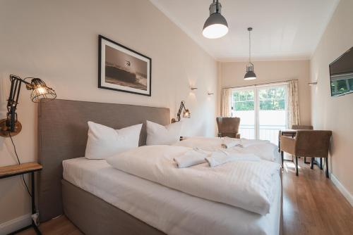 En eller flere senge i et værelse på Das Handtuchhaus - Wohnen im schmalsten Haus - Mittendrin