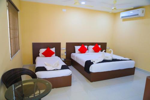 Katil atau katil-katil dalam bilik di Kalpana Residency