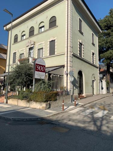a sign in front of a building at ALBERGO 900Strati in Bergamo