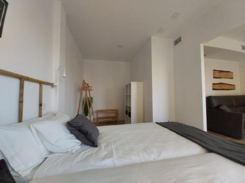 Katil atau katil-katil dalam bilik di Acero y Piedra Apartamentos con jardín privado