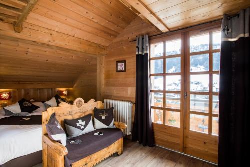 Postel nebo postele na pokoji v ubytování Les Chalets de La Griyotire