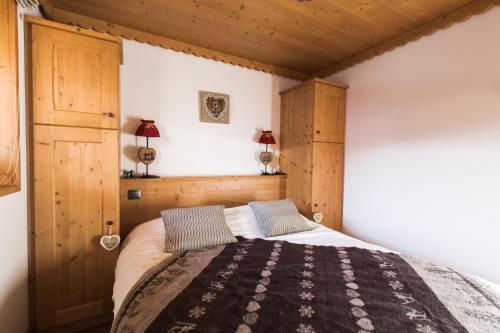 Ένα ή περισσότερα κρεβάτια σε δωμάτιο στο Les Chalets de La Griyotire