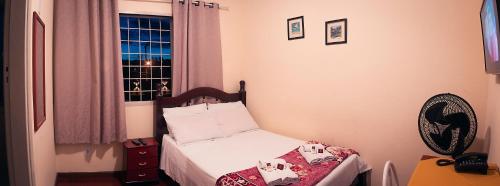 Katil atau katil-katil dalam bilik di Hotel Garfo de Ouro