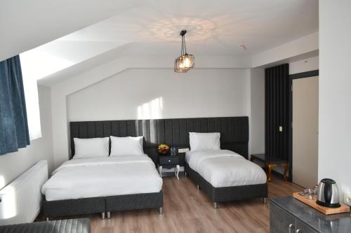 Un ou plusieurs lits dans un hébergement de l'établissement Avcılar Garden Hotel