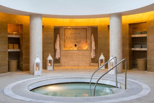 a hot tub in the middle of a building at Terme di Saturnia Natural Spa & Golf Resort - The Leading Hotels of the World in Saturnia