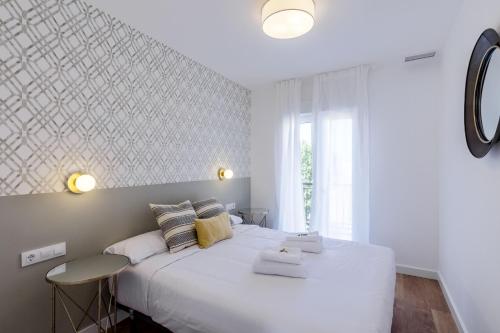 Ένα ή περισσότερα κρεβάτια σε δωμάτιο στο Style Apartments by Olala Homes