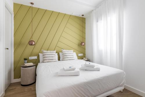 Ένα ή περισσότερα κρεβάτια σε δωμάτιο στο Style Apartments by Olala Homes