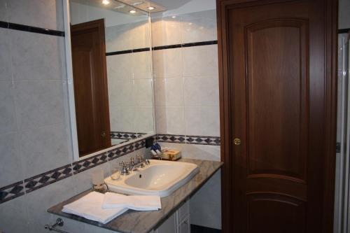 a bathroom with a sink and a mirror at La Ca' Nova in Lurago D'Erba 