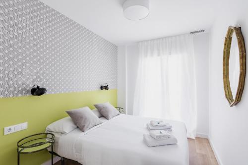 מיטה או מיטות בחדר ב-Style Apartments by Olala Homes