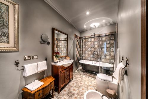 Et badeværelse på Navona Grand Suite