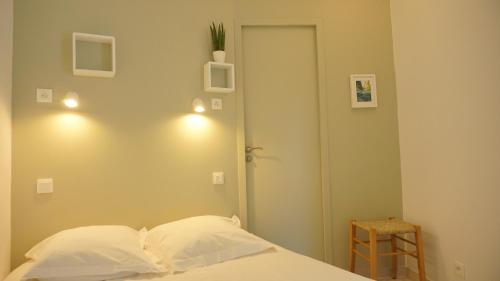 Krevet ili kreveti u jedinici u okviru objekta Maison Jardin Wifi - Climatisation - 100 m plage sauvage - 20 min Perpignan