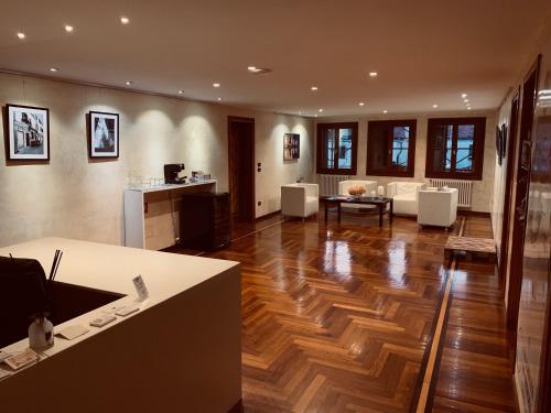 a kitchen and living room with a wooden floor at Ai Sogni in Venice