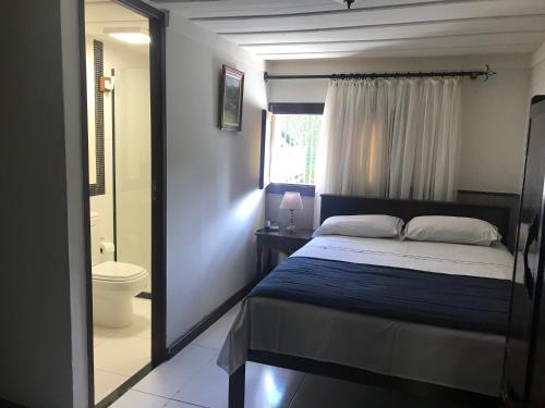 Cama o camas de una habitación en Pousada Dom Petrópolis