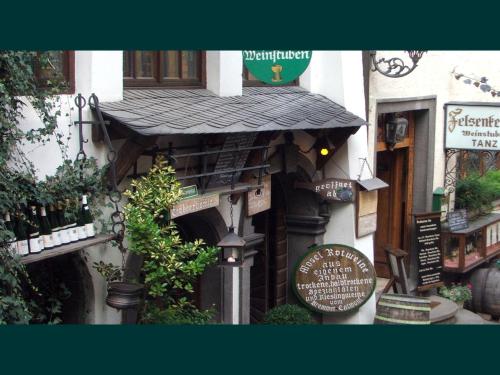 a building with signs on the side of it at Appartement Moselblick in Cochem