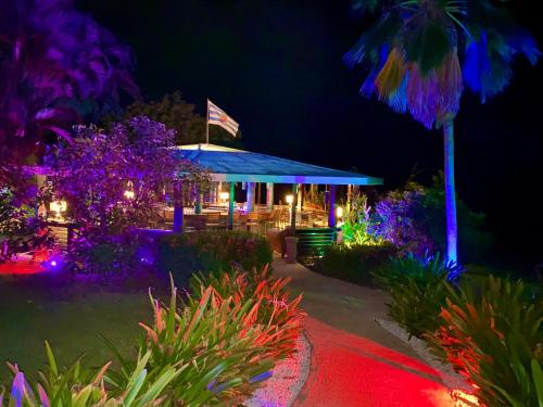 a gazebo with an american flag at night at Blue Horizon Boutique Resort in Vieques