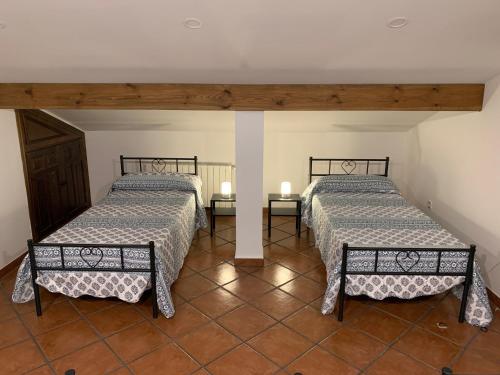 En eller flere senge i et værelse på La Casita de las Hortensias
