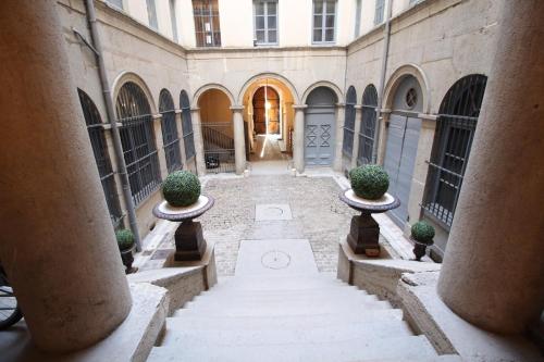 an empty hallway of a building with a door at 21Royale in Lyon