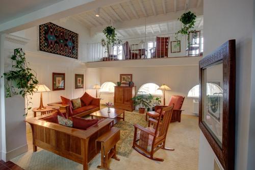 a living room with a couch and chairs at Geneva On The Lake Boutique Resort Hotel in Geneva