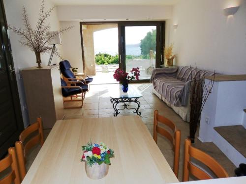 a living room with a table and a couch at Pefkos Beachfront Villa in Pefki Rhodes