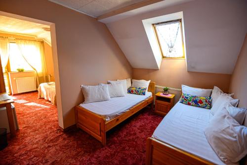 Postel nebo postele na pokoji v ubytování Family Hotel Chichin