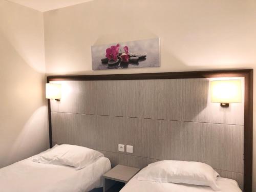 Ένα ή περισσότερα κρεβάτια σε δωμάτιο στο Hotel et Résidence Cala di sole