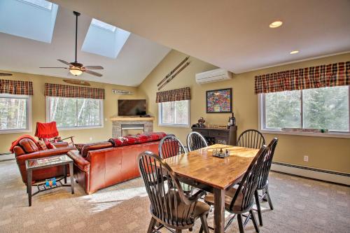 a living room with a couch and a table at North Conway Retreat - 1 Mi to Cranmore Mountain! in North Conway