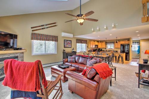 a living room with a couch and a table at North Conway Retreat - 1 Mi to Cranmore Mountain! in North Conway