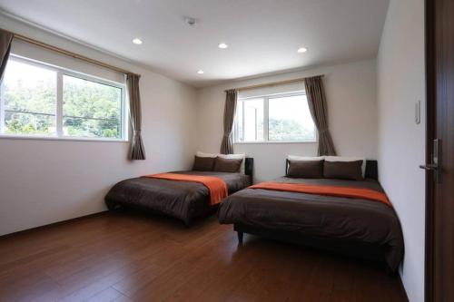 Kahoo House -SEVEN Hotels and Resorts- tesisinde bir odada yatak veya yataklar