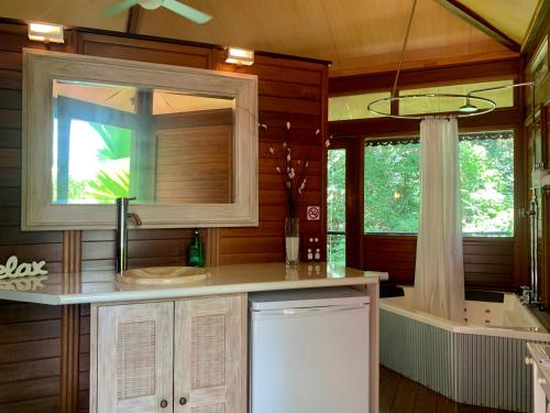 A kitchen or kitchenette at Cairns Rainforest Retreat