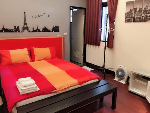 Postel nebo postele na pokoji v ubytování Funja Colorful Hotel