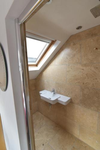 A bathroom at Beach Central with Allocated Parking and Patio
