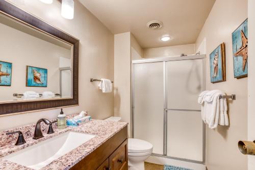 a bathroom with a shower and a sink and a toilet at Sand & Sea: Coastal Range (312) in Seaside