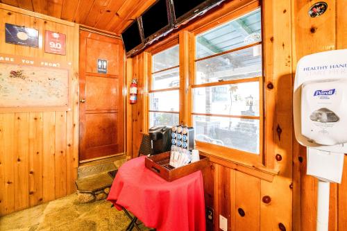 a room with a table and a window on a train at The Kern Lodge in Kernville
